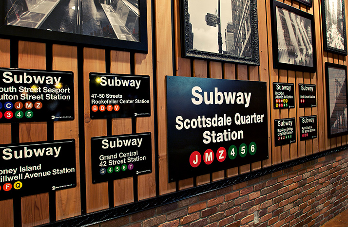 Grimaldi's interior wall with various framed pictures